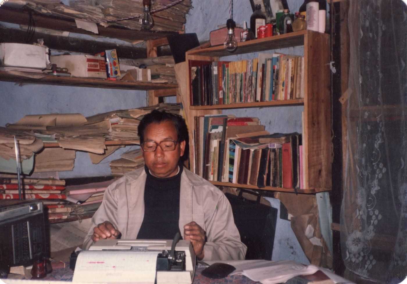 Lalhmingliana Torell who owned and ran ‘Sikni Eng’ news from the 70s until it was shut down in the early 2000s. The picture was taken while he was working in his office. 